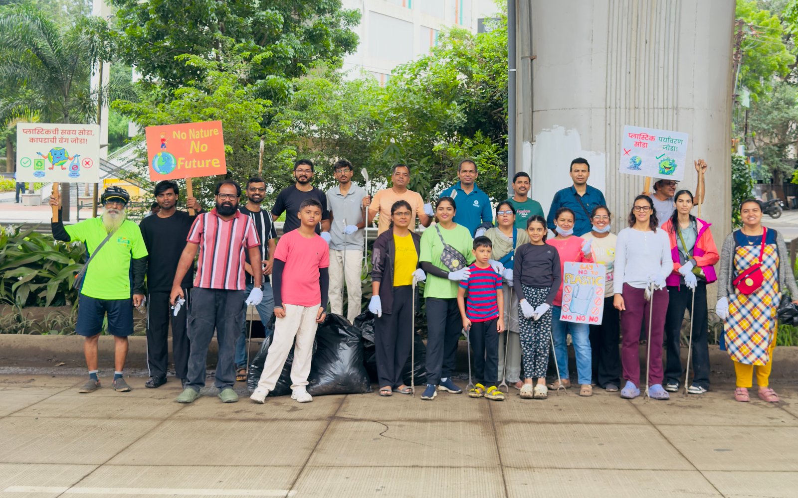 Volunteers clearing plastic along Ramkund ghats